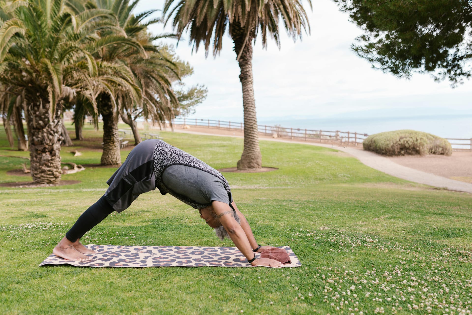 Man doing downward facing dog yoga pose